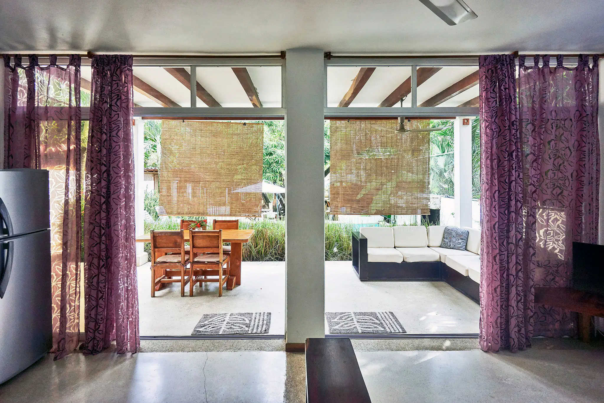 White apartment — ground floor patio directly in front of the pool